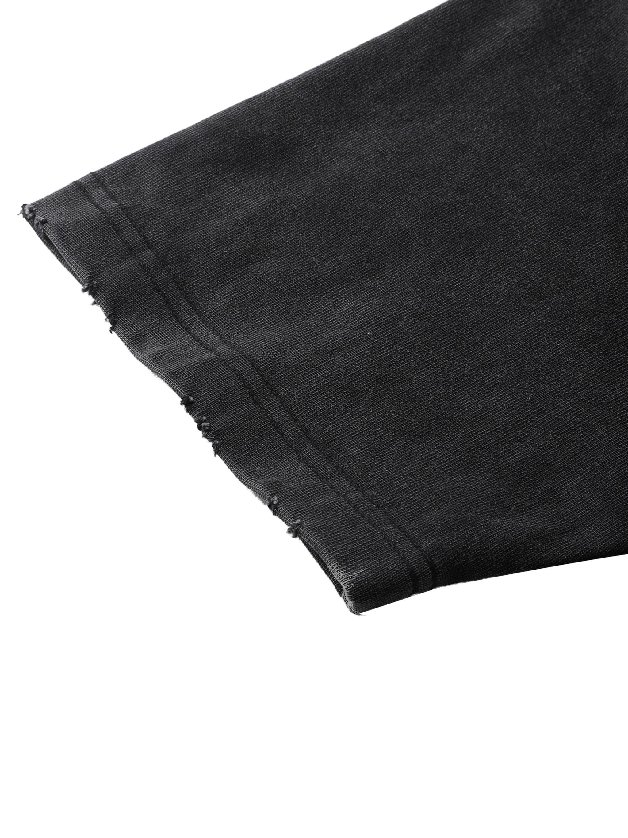 Close-up of black denim fabric with a white background